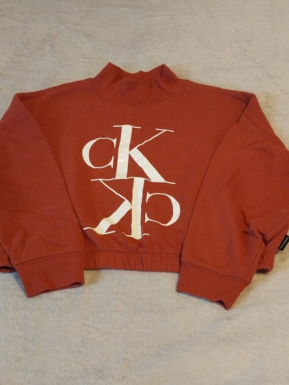 Calvin Klein Rust Red Cropped Turtleneck Sweater with White Logo